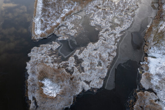 snow covered earth, ice covered river. Aerial landscape, abstract lines and shapes. - Powered by Adobe