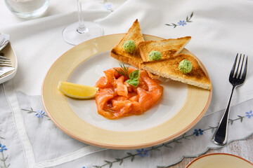 Elegant Composition of Lightly Salted Salmon with Toasts on a Sophisticated Table Setting
