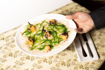 close up of a woman holding a salad