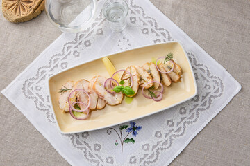 Exquisite Smoked Mackerel Slices on Elegant Embroidered Linen with Fresh Garnish