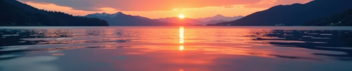 Fototapeta premium Gentle waves on still lake water, sunset hues, pattern, vibrant