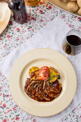 Gourmet Presentation of Tongue with Demi-Glace, Fire-Roasted Potatoes, and Baked Tomato