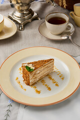 Delightful Slice of Honey Cake Medovik in Warm Earth Tones