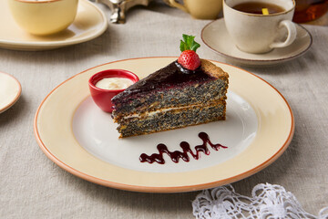 Decadent Poppy Seed Chocolate Cake Slice on Elegant Table Setting