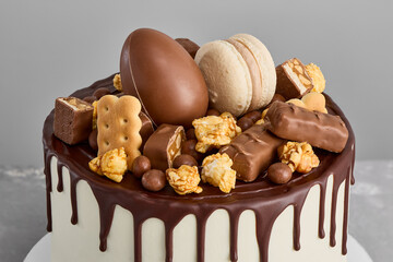 Decadent Chocolate and Salted Caramel Cake with Nuts and Cookies A Culinary Art Masterpiece in Rich, Warm Hues