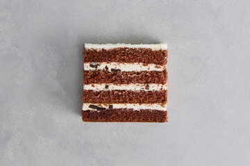 Chocolate Cake Slice on Minimalist Gray Background with High Contrasts