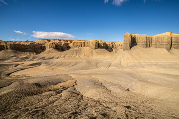 Eroded Badlands Landscape with Blue Sky