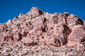 Fototapeta premium Majestic Red Rock Cliffs Against Blue Sky