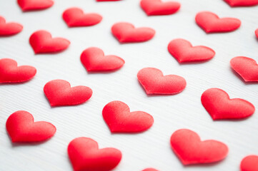 St Valentines day background. Red hearts on the white wooden background, shallow DOF, Valentines day still life