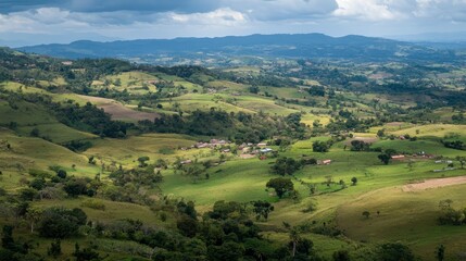 Fototapeta premium Majestic View of a Lush Green Valley with Rolling Hills and Rural Homes