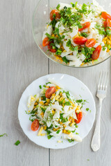 seafood salad with cabbage, eggs, tomatoes and other vegetables