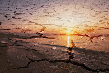 Dry ground as background with sunset.