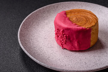 Round sweet New York roll croissant with raspberry cream filling