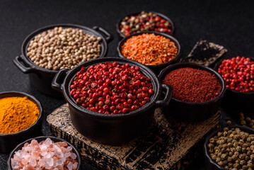 Variations of spices, allspice, turmeric, paprika, salt in ceramic bowls