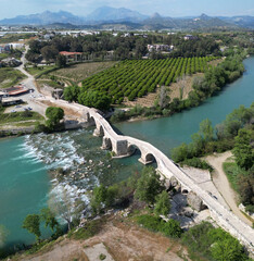Fototapeta premium Koprucay Bridge ( Aspendos Bridge ), located in Antalya, Turkey, was built during the Seljuk period.