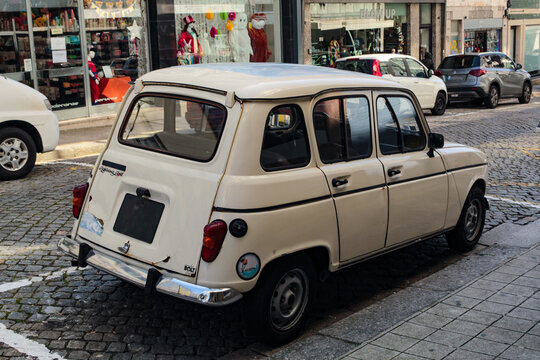 A parked Renault 4, or 4L automobile, the "Quatrelle", an economy car produced by Renault between 1961 and 1994.