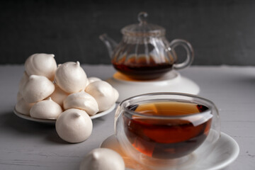 tea, teacup, plate, meringue, cookie, white, elegant, homemade, setting, dark, transparent, partially, filled, beverage, sugar, cozy, ambiance, enjoying, sweets