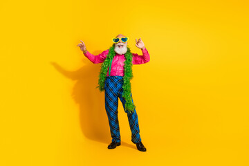 Full length photo of nice senior male dancing boa good mood wear pink shirt plaid pants suspenders fancy outfit on yellow color background