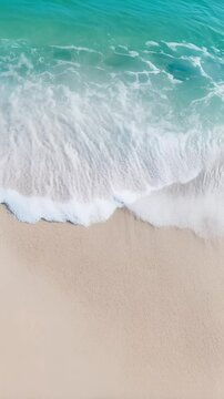Pristine turquoise waves gently lap against a serene sandy beach in slow motion, capturing the essence of a peaceful summer retreat at a tropical resort