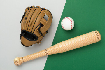 Baseball glove and bat with ball on color background, top view