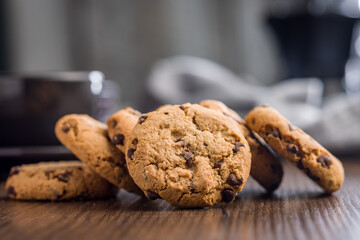 Chocolate chip cookies on wooden table.