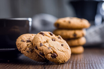 Chocolate chip cookies on wooden table.