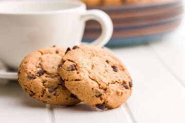 Chocolate chip cookies on white table.