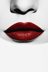 Obraz premium A close-up of red lips, showing their glossy finish.