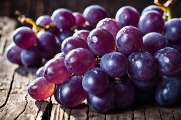 Fresh purple grapes on wood table