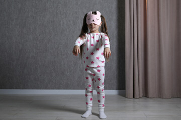 Little girl suffering from sleepwalking at home