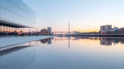 Fototapeta premium Calm sunrise over city river, modern building reflecting
