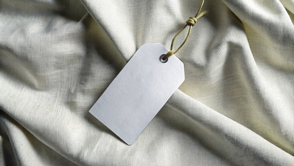 Blank White Price Tag Mockup on Natural Burlap Fabric with Rustic Texture
