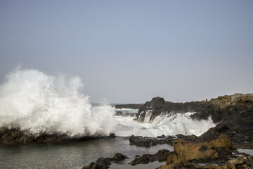 Waves crashing against a rocky shoreline in Gran Canaria.