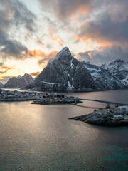 Epic sunset over a mountain and fjord in Norway. 