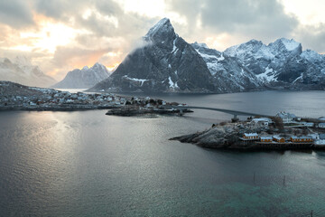 Sunset over the ocean and snow capped mountains in Norway. 
