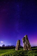 Northern Lights Arora Borealis and Milky Way over Avebury Stone Circle, Wiltshire, UK