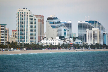 A city skyline with a beach in the background