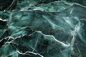 Naklejka premium Close-up of textured green marble with intricate natural vein patterns