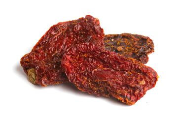 dried tomato pieces on white background