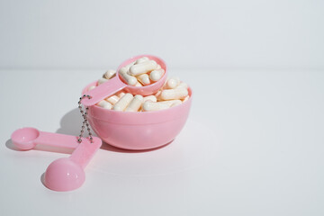 Pills close-up on a light background. Taking vitamins or medications. Concept of healthcare, medicine, pharmacy, disease prevention  