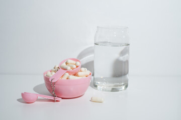 Pills close-up on a light background. Taking vitamins or medications. Concept of healthcare, medicine, pharmacy, disease prevention  