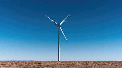 Fototapeta premium Wind turbine on a vast plain under a clear blue sky; renewable energy