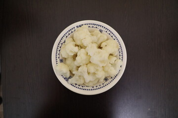 A healthy snack. Boiled cauliflower in a bowl.