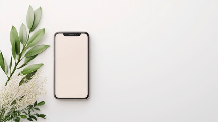 A minimalist workspace featuring a smartphone surrounded by greenery for an aesthetically pleasing look. Perfect for showcasing modern technology and nature.