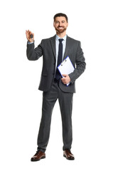 Cheerful salesman with car key and clipboard on white background