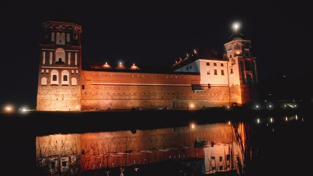 The historic fortress reflected in the river during the night illuminations