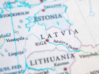 Global view with Latvia highlighted. Maps, geography, European location, data visualizations.