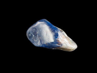 Fototapeta premium Sodalite mineral. Rich blue color with white veining. Natural rock, gemstone, often used in decorative arts.