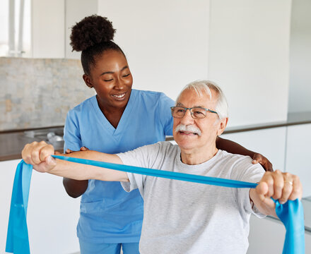 therapist senior man exercise exercising patient physical woman girl therapy care nurse recovery physiotherapy fitness stretching stretch band elderly support training