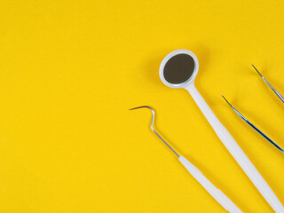 Dental tools for examination. Probes, mirrors, picks; close-up on instruments used for oral health diagnosis.